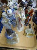 A tray of eight Oriental figurines by Leonardo etc