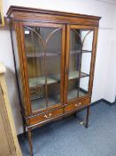 A late Victorian inlaid mahogany china cabinet