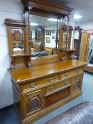 A late Victorian oak mirror back sideboard
