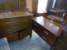 An inlaid mahogany dressing chest with matching linen cupboard