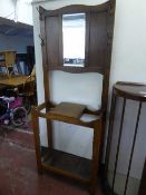 An early twentieth century oak mirrored hall stand