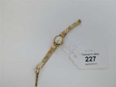A lady's 9ct gold Rotary wristwatch on 9ct gold bracelet, 13.