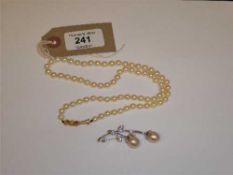A set of of Lotus cultured pearls with gold clasp,