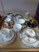 A tray of antique demi-tasse cups and saucers including Hammersley china, Carlton ware,