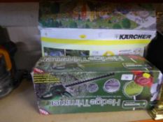 A boxed Karcher 210 plus pressure washer together with a Kingfisher electric hedge trimmer