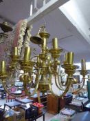 A decorative brass twelve branch chandelier together with two boxes of matching wall lights