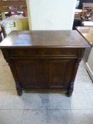 A late nineteenth century double door walnut burr cabinet fitted with a drawer