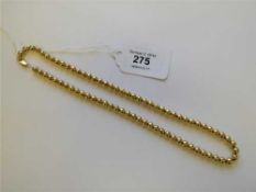 A 9ct gold bead necklace, 31.