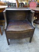 A Victorian inlaid mahogany commode