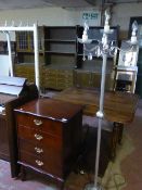 A silvered four-way floor lamp together with a mahogany effect filing chest