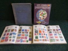 Four early 20th century stamp albums and stamps