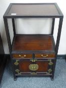 A Chinese hardwood display stand with cupboard below