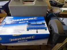 A SilverLine dovetail jig together with a Clarke bench grinder and a cased Nutool electric hammer