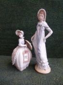 Two Nao figures - Girl with parasol and girl in flowing dress