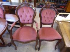 A set of four Italian style dining chairs