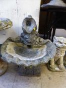 A garden water jug fountain with pump