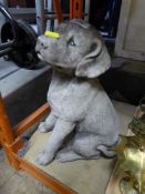 A garden figure of a puppy