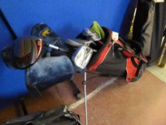 A Slazenger golf bag containing a set of Golden Bear golf clubs and a Diablo Edge driver