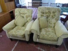 A three piece lounge suite upholstered in sand floral print
