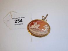 A yellow metal mounted cameo brooch depicting cherubs