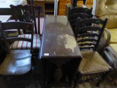An oak drop leaf table, pair of ladder back chairs,
