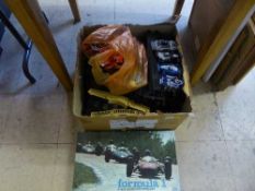 A box of Scalextric cars and track together with a formula One racing game