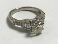 A large solitaire diamond ring in 18ct white gold, the cushion shaped old cut stone approximately 1.
