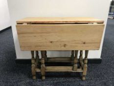 A pine topped gate leg table