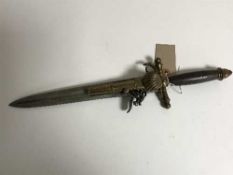 A reproduction flintlock knife-pistol