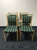 Four blond oak dining chairs upholstered in striped fabric