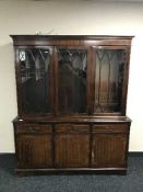 An inlaid mahogany triple door bookcase