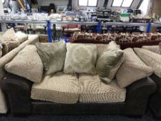 A contemporary three piece two-tone lounge suite with scatter cushions