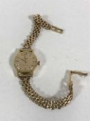 A lady's 18ct gold Omega Geneve wristwatch on 9ct gold strap, 16.