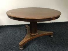 A circular Victorian mahogany pedestal breakfast table