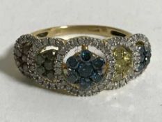 A gold ring set with various coloured diamonds, 3.