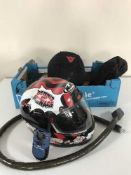 A box of two motor cycle helmets in carry bags,