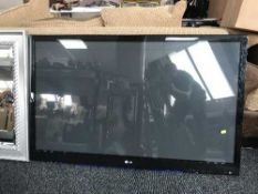 An LG wall mounted 50 inch plasma TV with remote (no lead)