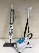 A Tobi steam cleaner together with a Shark floor steam cleaner and a kitchen pedal bin