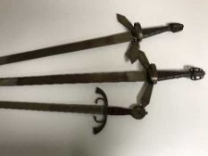 Three replica claymore swords
