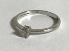 A 9ct white gold diamond solitaire ring, the diamond weighing 0.