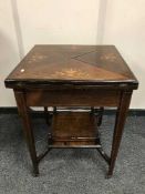 A Victorian inlaid rosewood envelope card table