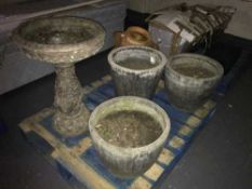 A stone garden bird bath,
