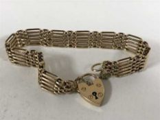 A 9ct gold padlock bracelet, 19.