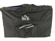 A Homcom folding massage bed in carry bag