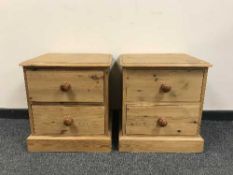A pair of pine two drawer bedside cabinets (2)