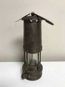An antique copper and brass miner's lamp