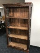 A set of contemporary mango wood open shelves