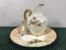 A Royal Worcester hand painted blush ivory gilt handled jug,