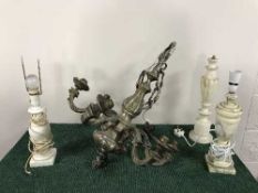 A heavy metal six branch chandelier with marble shades and a box of three marble table lamps