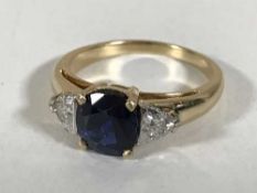 An 18ct gold sapphire and diamond ring,